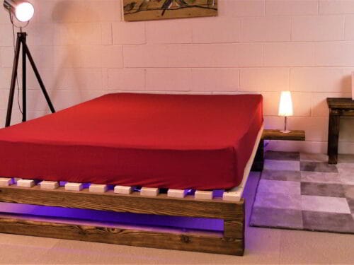 Red waterbed sheet over a mattress